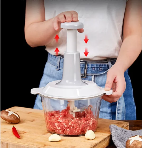 A new device that includes a manual fruit and vegetable slicer, onion chopper, small meat grinder, and kitchen cutting tools. It is a press-type meat grinder.