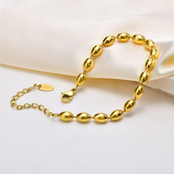 Elegant beaded bracelet made of stainless steel and gold beads. - Image 3