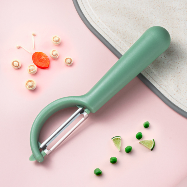 Fruit and vegetable peeler made of stainless steel with rotating blades for use in the kitchen. - Image 4