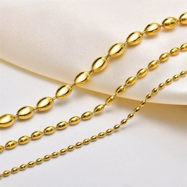 Elegant beaded bracelet made of stainless steel and gold beads. - Image 4