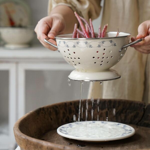 Fruit, vegetable, and rice sieve colander with a home basics set in a factory-supplied stainless steel basin. Profound Colander - Image 4