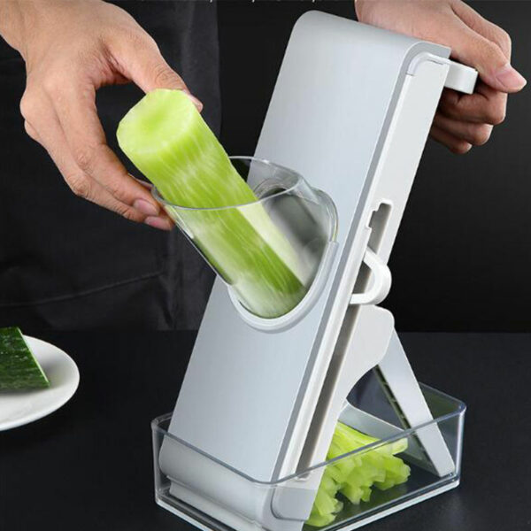 Multifunctional Vertical Vegetable Grater with Rotating Fruit and Vegetable Slicer Shredder in a Kitchen