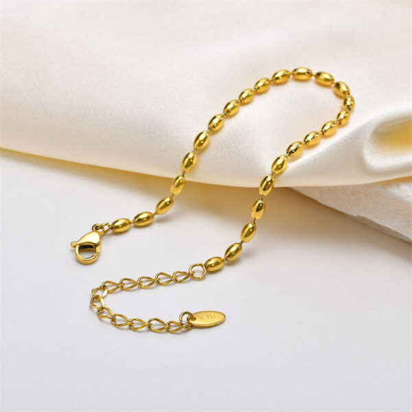 Elegant beaded bracelet made of stainless steel and gold beads. - Image 5