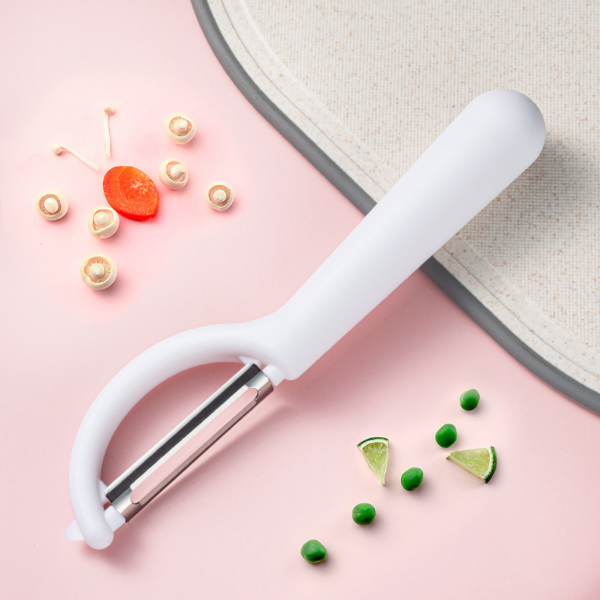 Fruit and vegetable peeler made of stainless steel with rotating blades for use in the kitchen. - Image 5