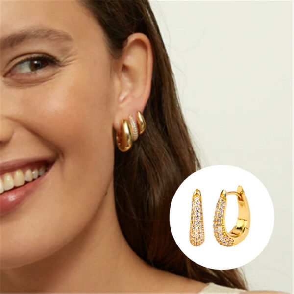 Bold and striking fine jewelry earrings with a U-shaped ear cuff adorned with diamonds for a cutting-edge look