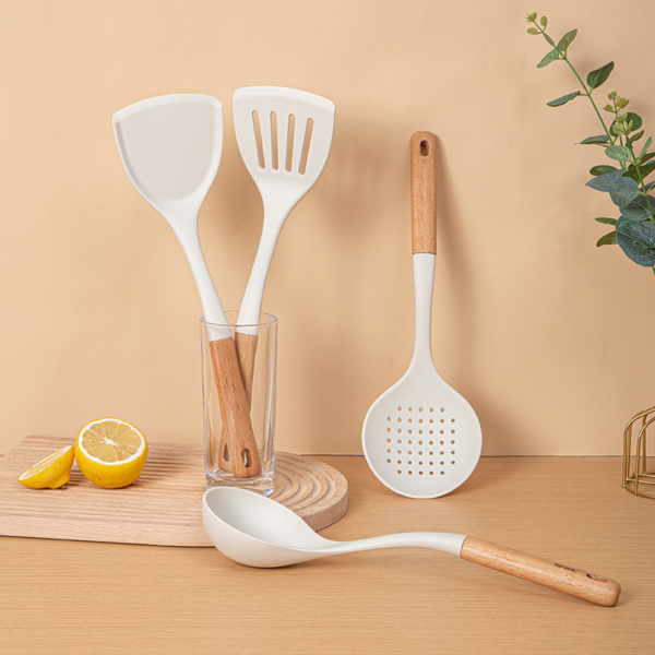 This 7-piece set of nonstick silicone kitchen utensils accessories with wood handles includes a spoon and spatula. - Image 3