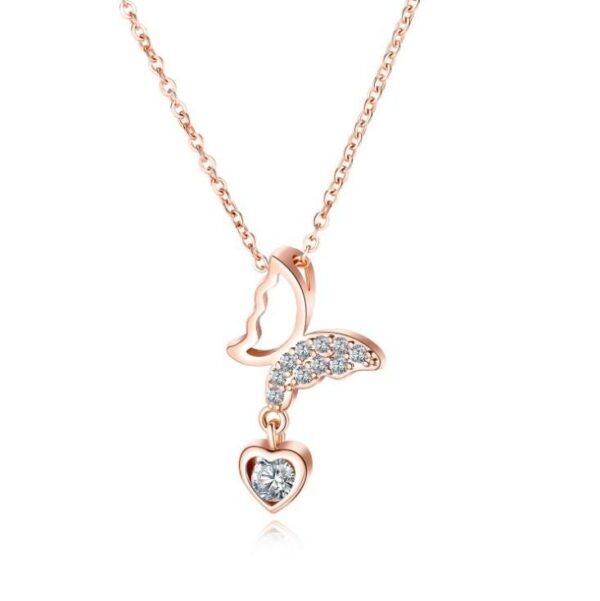 Women's delicate butterfly wing necklace with classic pearl chains made of stainless steel and plated in gold. - Image 4