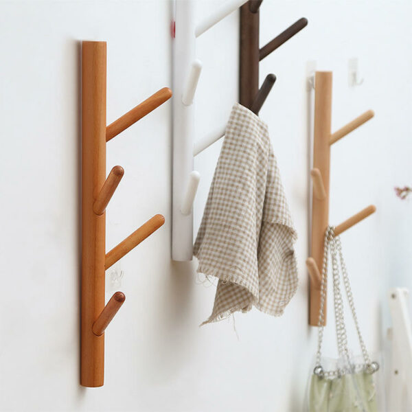 Wall-mounted wooden coat racks stands with a tree-shaped hanger for clothes and hats in the living room - Image 2