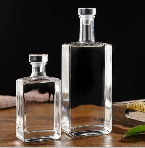 Luxurious glass bottle with a glass lid, holding 500ml, 200ml, and 100ml of whiskey gin. - Image 2