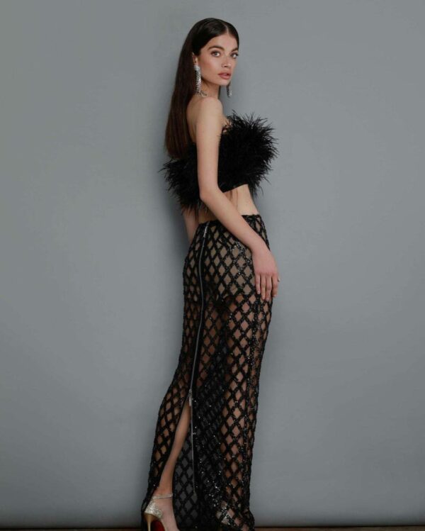 Feather crop top and sequin tulle skirt in a two-piece ensemble for a luxurious, sultry party look for ladies