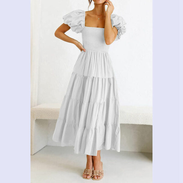 See this adorable women's summertime flowy smocked midi dress with a square neck and puffy sleeves. - Image 4