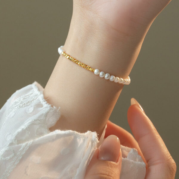 Women's gold-plated bracelets made of geometric small bits of square pieces and natural real pearls set in 925 sterling silver form.