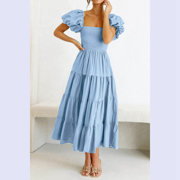 See this adorable women's summertime flowy smocked midi dress with a square neck and puffy sleeves.