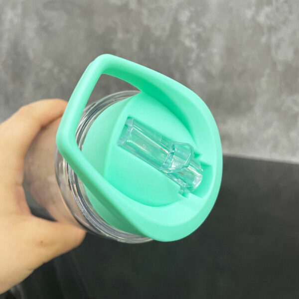 Snow globe water bottles for kids with a flip-top lid and a strap, made of double-layered plastic and acrylic, that are reusable and portable. - Image 5