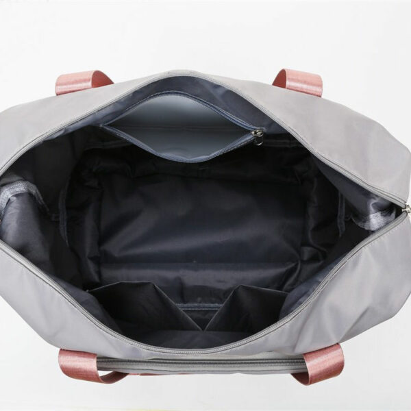 The Fashion Duffel Bag is a large capacity folding travel bag made of polyester that is waterproof and has a front pocket for women. - Image 7