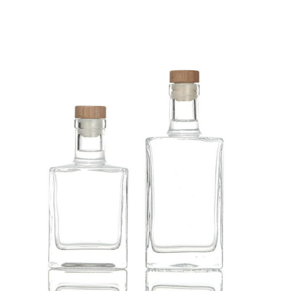 Luxurious glass bottle with a glass lid, holding 500ml, 200ml, and 100ml of whiskey gin. - Image 5